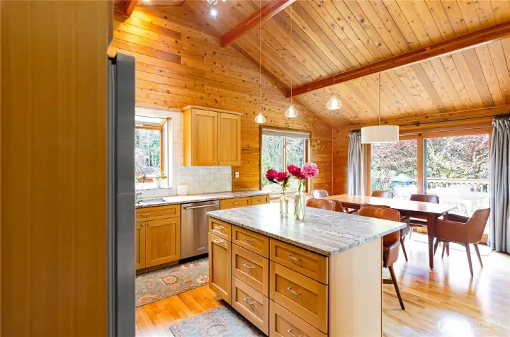 View of dining room off kitchen. Slider leads to an expanded wood deck that goes along the whole length of the back yard. View of dining room off kitchen. Slider leads to an expanded wood deck that goes along the whole length of the back yard.