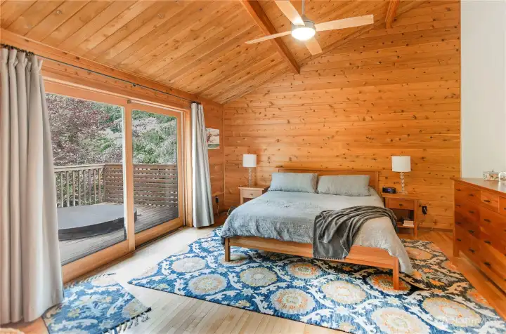 Primary suite is very spacious and has an oversized sliding door to access the deck and hot tub. Primary suite is very spacious and has an oversized sliding door to access the deck and hot tub.