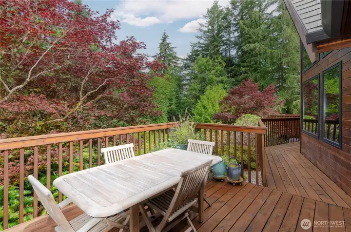 Outdoor deck overlooks the gardens and has a perfect spot for outdoor dining. Outdoor deck overlooks the gardens and has a perfect spot for outdoor dining.