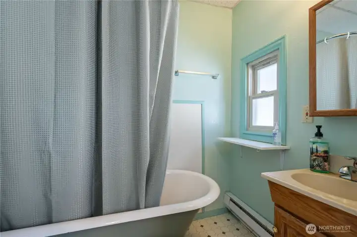 Full bathroom serving the office space, adding convenience for employees, clients, or tenants.