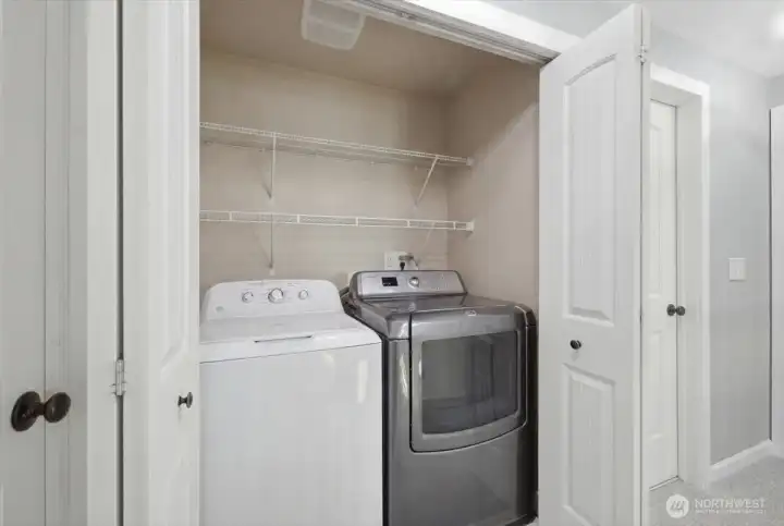 Laundry room is conveniently located on the upper level betwen the Primary Suite and additional bedrooms