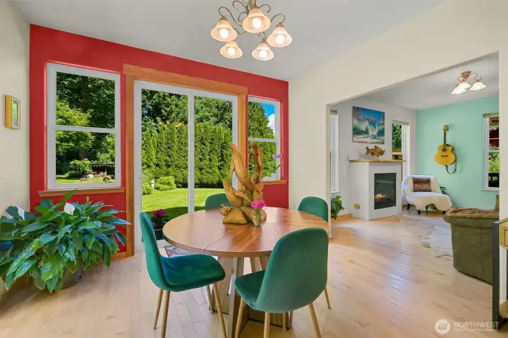 The dining area enjoys views of the backyard and gardens through large sliding glass doors, making it easy to step outside for meals on the deck or patio. Like much of the home, it was designed to take advantage of the property's private, natural setting. The dining area enjoys views of the backyard and gardens through large sliding glass doors, making it easy to step outside for meals on the deck or patio. Like much of the home, it was designed to take advantage of the property's private, natural setting.