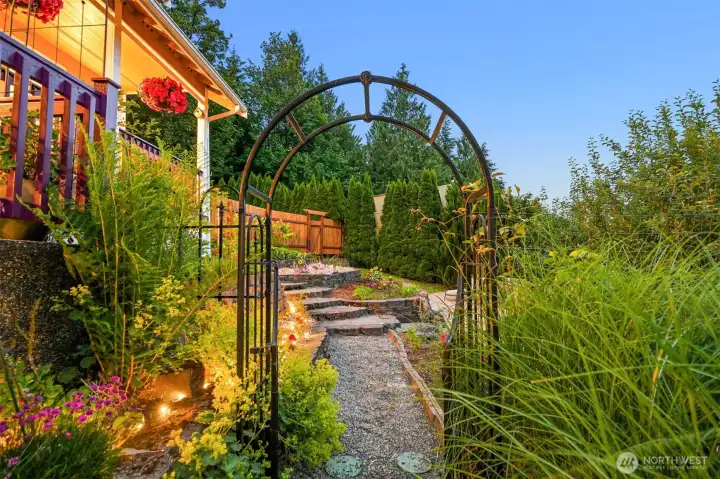 Garden pathways connect the home's various outdoor spaces, leading through flower beds, gathering areas, and productive gardens. Much of Forest Haven is experienced on foot, with each turn revealing another pocket of the landscape to explore and enjoy. Garden pathways connect the home's various outdoor spaces, leading through flower beds, gathering areas, and productive gardens. Much of Forest Haven is experienced on foot, with each turn revealing another pocket of the landscape to explore and enjoy.
