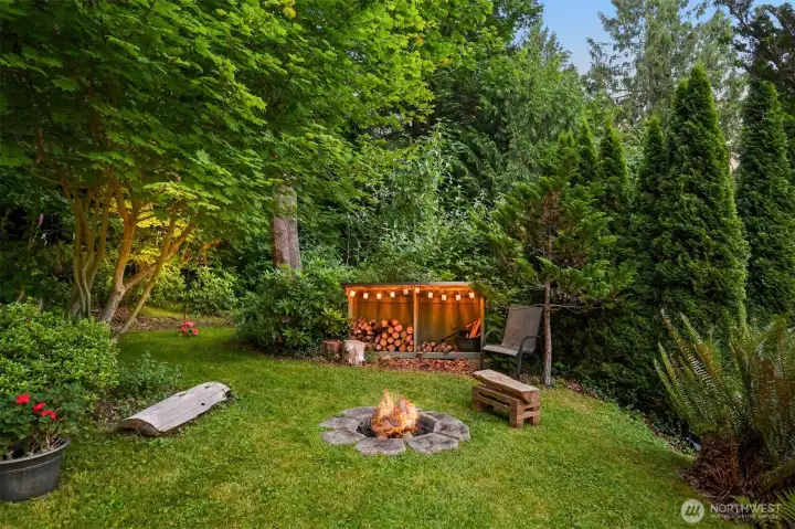 This lower fire pit is tucked into the gardens near the home, creating a cozy gathering spot for evenings with family and friends. It's one of two dedicated fire pit areas on the property, each offering a different setting and experience. This lower fire pit is tucked into the gardens near the home, creating a cozy gathering spot for evenings with family and friends. It's one of two dedicated fire pit areas on the property, each offering a different setting and experience.