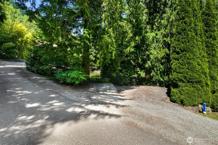 A dedicated parking area provides space for a small RV, boat, trailer, or additional vehicles, helping keep the main driveway and living areas uncluttered. It's a practical feature that's increasingly difficult to find on typical residential properties. A dedicated parking area provides space for a small RV, boat, trailer, or additional vehicles, helping keep the main driveway and living areas uncluttered. It's a practical feature that's increasingly difficult to find on typical residential properties.