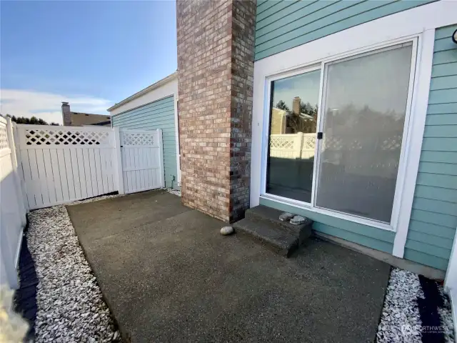 Slider off living room leads to this fully fenced, private patio!