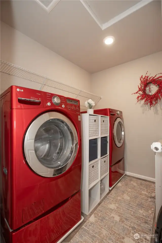 large laundry room with storage