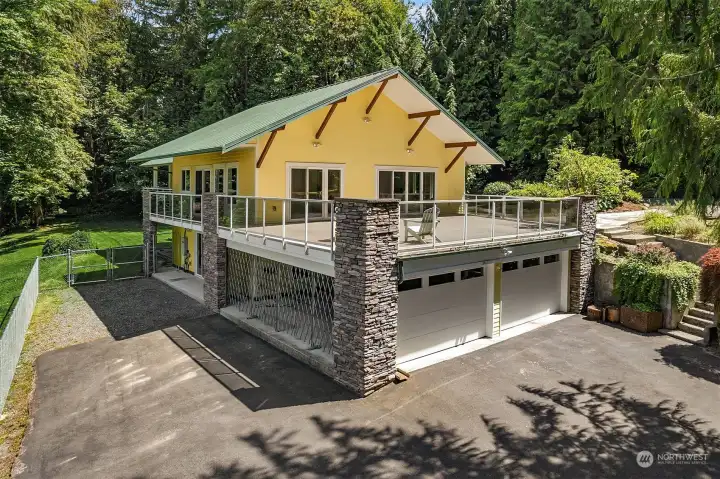 2 car garage/car port with charging station- yellow is actual color of home