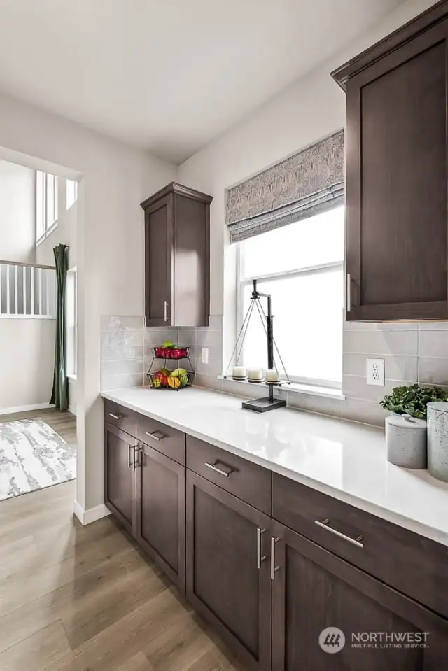 Butler's Pantry connects Kitchen & Dining. Across is a large walk-in pantry (not shown). Photos are for representational purposes only.  Colors and options may vary.