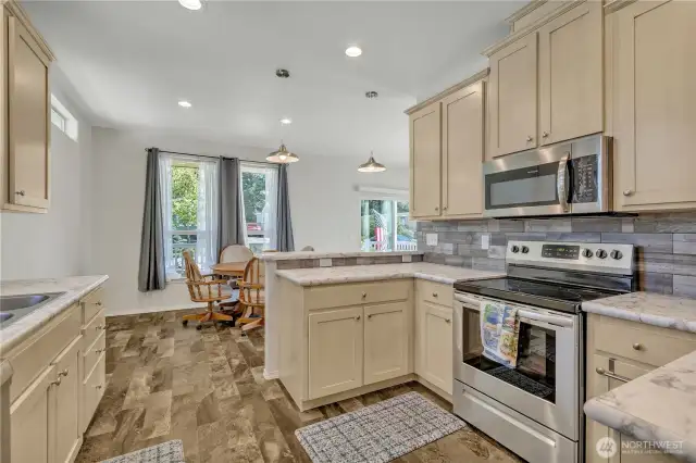 Well appointed kitchen with stainless appliances.