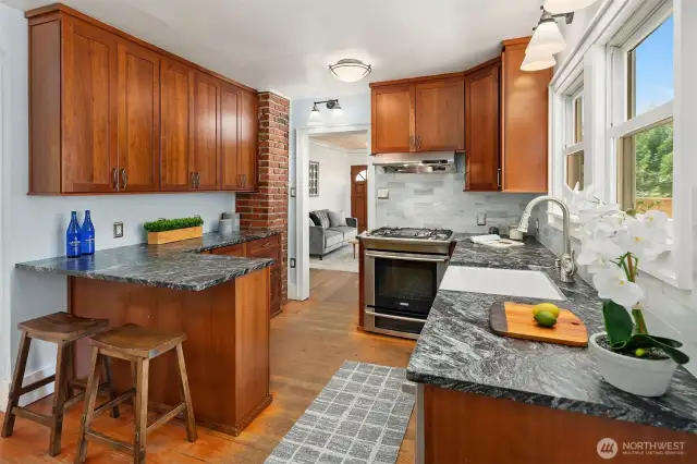 Updated eat-in kitchen with custom cabinetry & breakfast bar