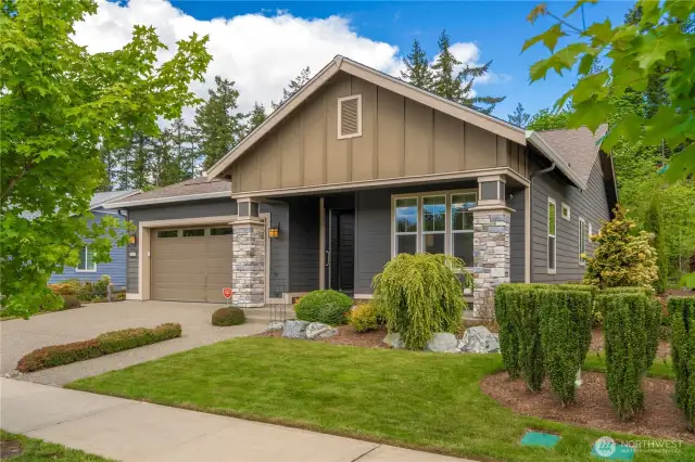 Statuesque street appeal with stone pillars and a wide front porch welcome you to this beautiful 3 bedroom home situated on a premier lot a short walk to the Seven Summits Lodge, Pickleball, Post & Pour Bistro & all amenities.