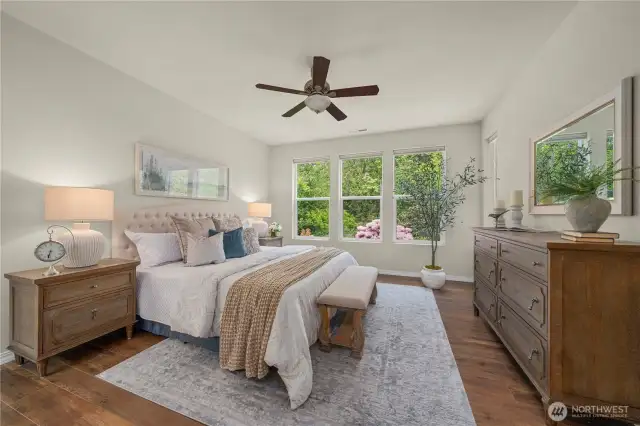 Generous primary bedroom overlooks your private backyard sanctuary.   Top down/bottom-up custom blinds with blackout shades.