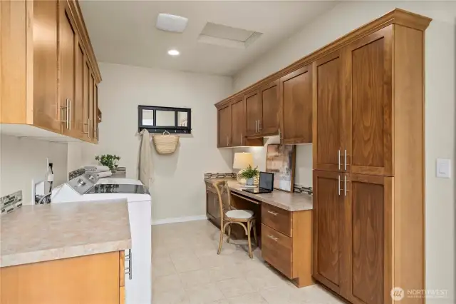 The multi-purpose Smart Space is a laundry room/mud room/craft space/workspace and offers a ton of cabinetry. Conveniently located between the garage and kitchen.