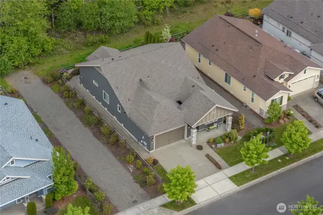 Gravel area is a storm drain easement owned by Pierce County accessed only a few times a year.  The plantings outside of the fence are maintained by the HOA. Provides extra space between you and your neighbor!