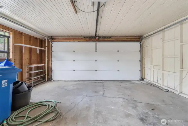2-car garage is attached, but has no access to inside the home. The man-door is next to the front door of the house.