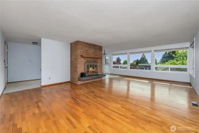 Showing the flow of the room - front door is on the left, dining room on the right side of the fireplace.