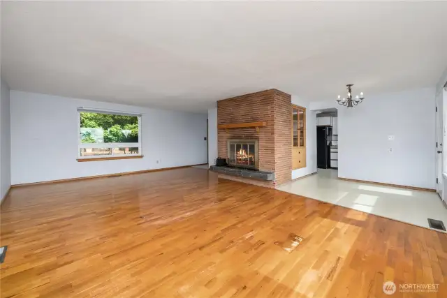 Separate dining area includes a built-in cabinet and access to the back deck.