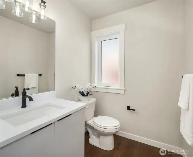 Conveniently located powder room on the second level