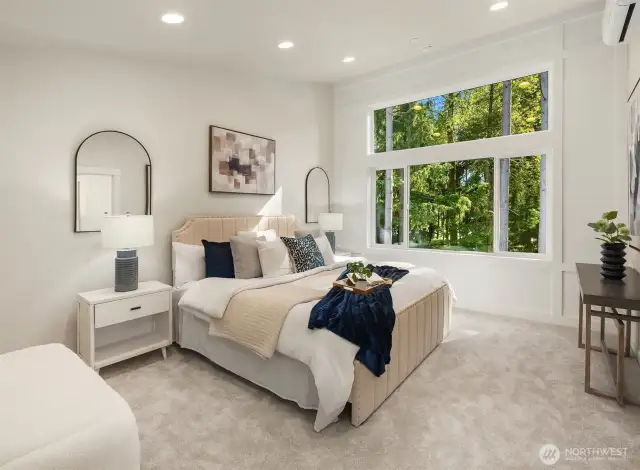 Luxurious primary suite featuring soaring vaulted ceilings