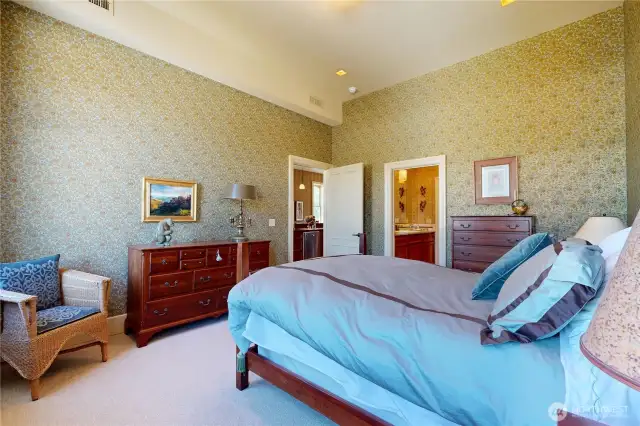Primary bedroom – generous space, tall ceilings, and direct access to the bathroom.