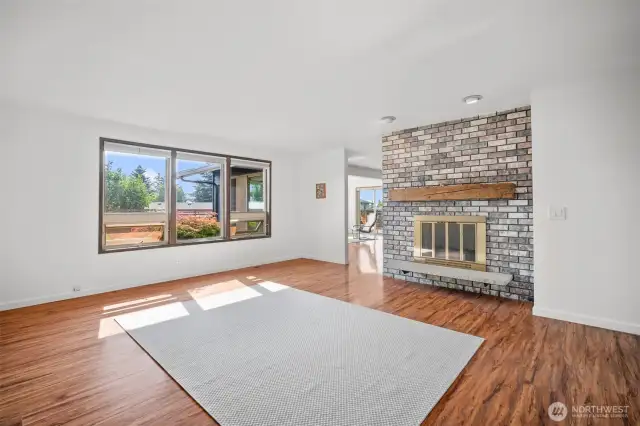 Upon entry on the left side there is a great flexible space with a wood burning fireplace