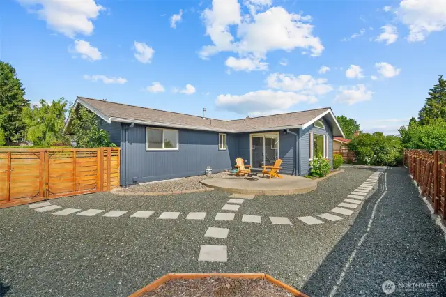 The back slider opens up to a patio and hardscaped backyard