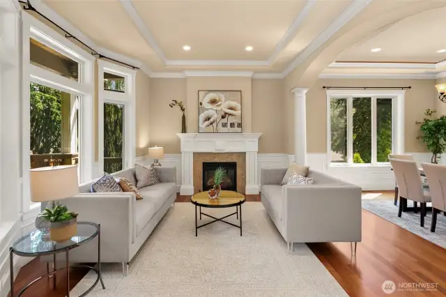 Flawless floor plan with 10’ coffered ceilings, grand tiled entry, exquisite columns, crown moldings and wainscoting throughout office, formal living and dining rooms. Beautiful formal living room showcases elegant gas fireplace and bay windows overlooking territorial views.