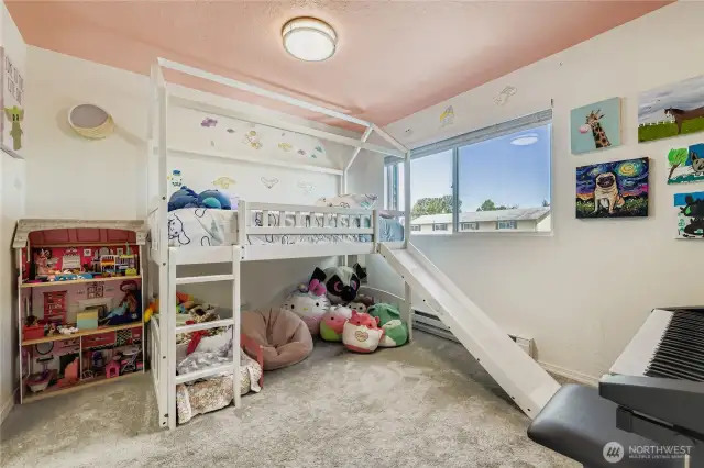 Secondary bedroom features updated windows and blinds
