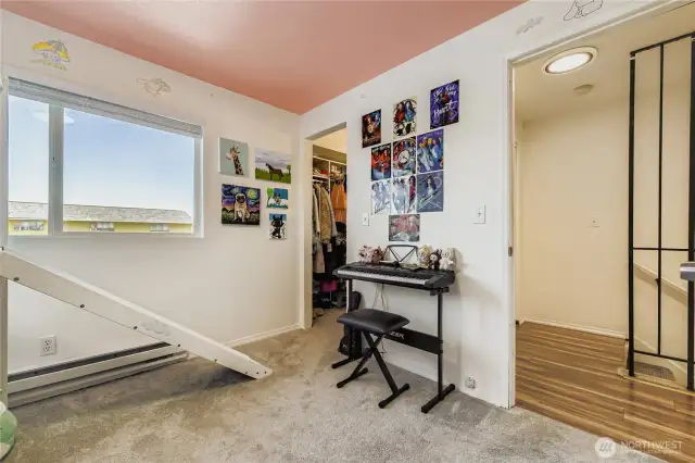 Secondary bedroom has large walk in closet with built-in shelving system.