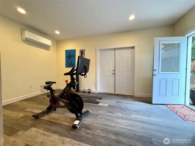 Double doors lead to shop. About 250 sq feet work great as a gym, gaming/media room, or business/office space