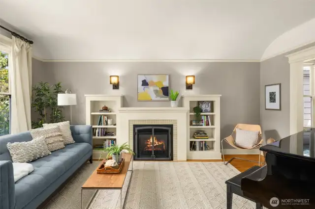 Spacious living room with high ceilings, cozy gas fireplace and quality built-ins.