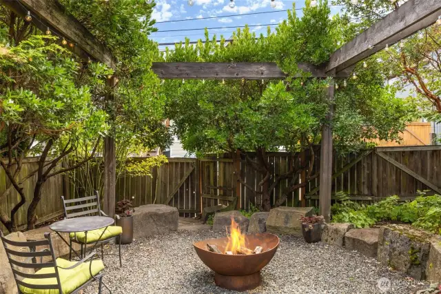 The backyard is a real oasis with lush landscaping, firepit, lighting, water feature and more.  It's an amazing getaway