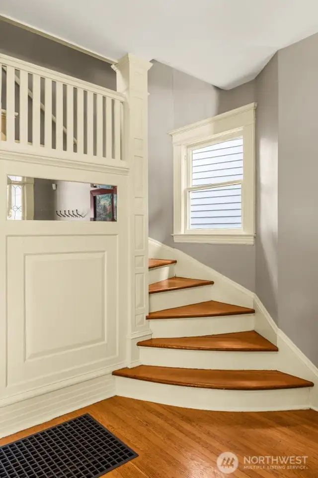 You'll love the classic trim and built-ins in this house.  Stairs here lead you up to 2nd floor.