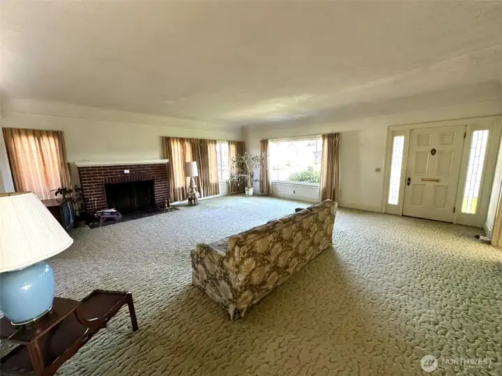 Expansive light and bright living room with wood fireplace