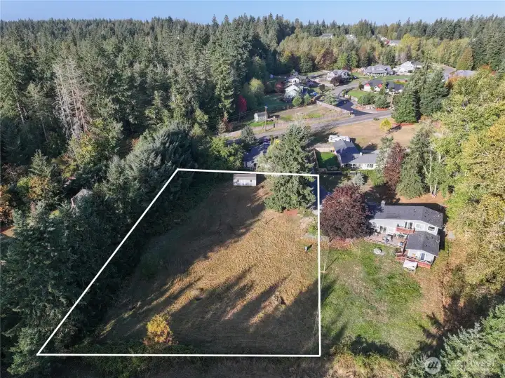 Beautiful cleared and fenced .85 acre lot with power and water already at property.