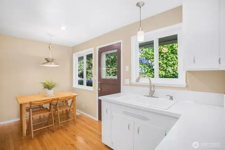 Another view of the kitchen with a close up of the kitchen sink.