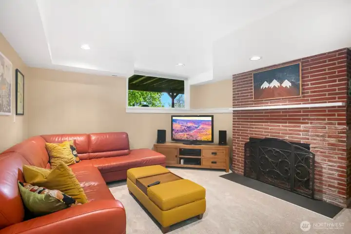 Down on the lower level there is a great family room with a 2nd wood-burning fireplace.