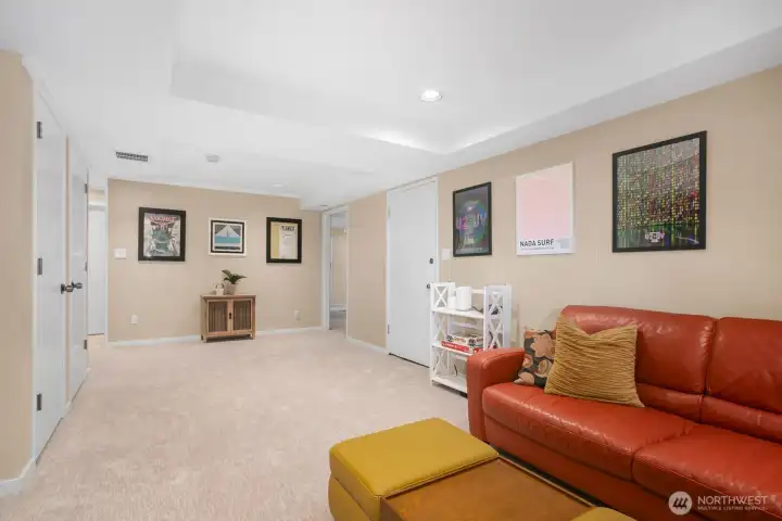 This is another view showing how spacious this lower level is, there's room to have a game table in the far end of the room.