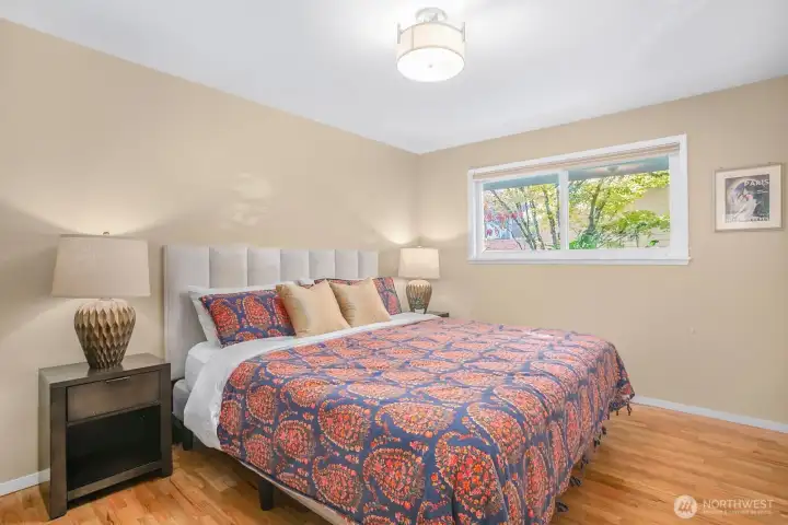 There are 3 bedrooms upstairs - this is the primary bedroom, and it fits a California king bed.