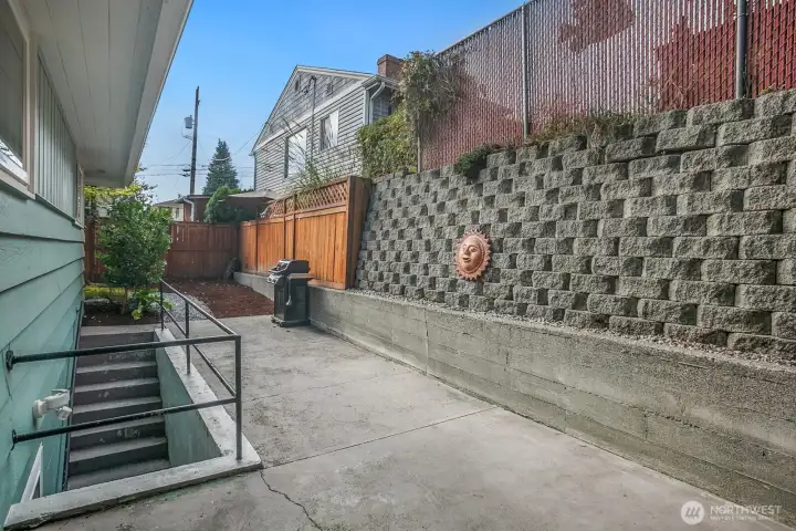 Another view of the back patio and retaining wall. There's room for more seating here.