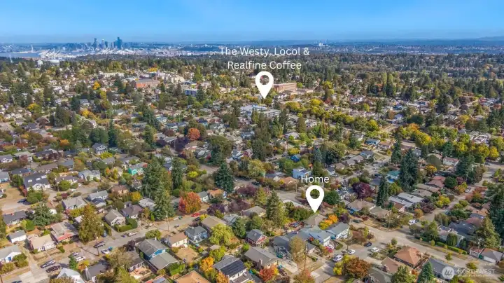 This drone shot shows the house in the lower right corner and the proximity to bars/restaurants and transit on 35th Ave SW.