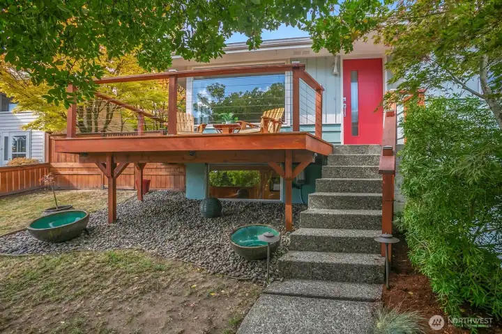 Another view of the front deck and yard.