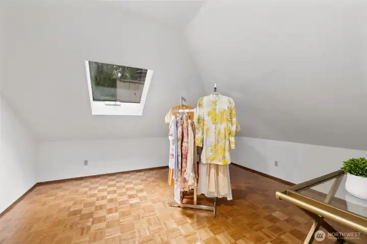 Primary suite dressing room or extra closet space.