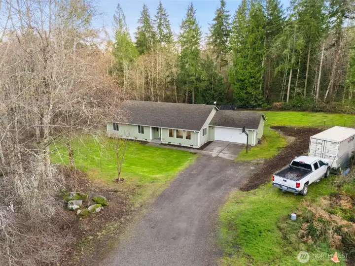 Front of house with view of backyard