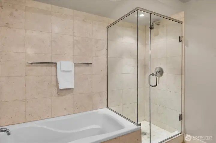 The full bath has a nice deep bathtub and a glass enclosed shower.