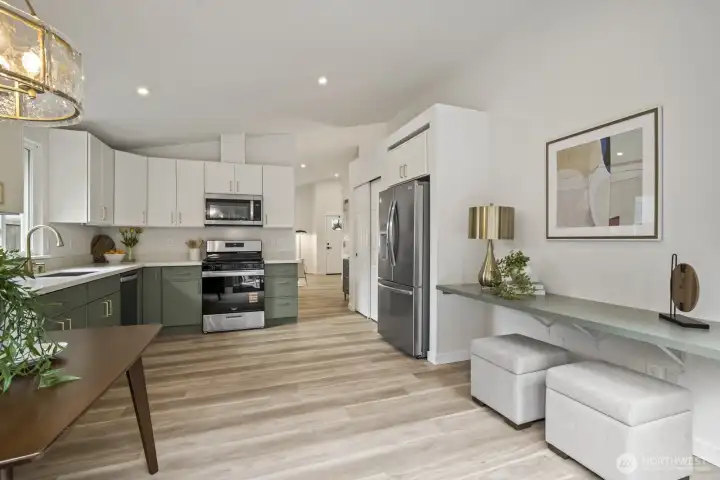 All-new stainless appliances, premium gas stove, and sleek quartz counters elevate this kitchen to modern perfection
