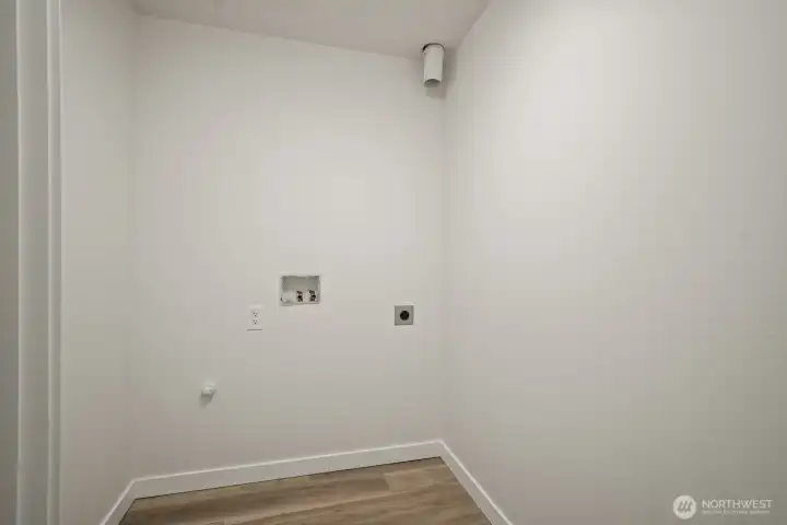 Handy dedicated laundry room with plenty of space