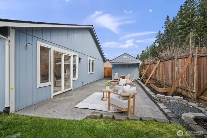 Fully fenced with planters and additional storage—perfect for tools and toys