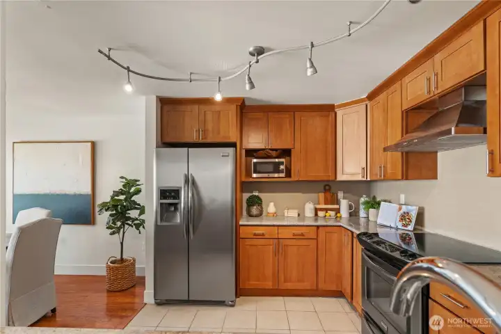 A spacious chef's kitchen with stainless steel appliances